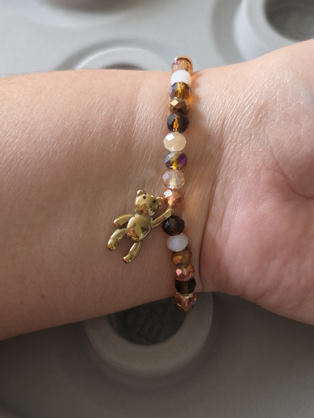 Beaded Bracelet with Gold Teddy Bear Charm
